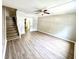 Living room featuring wood-look flooring and stairs at 1820 Mepkin Rd # 1019, Charleston, SC 29407