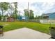 Spacious backyard with a lush lawn, shed, workshop, and privacy fence at 1989 Nitsa St, Johns Island, SC 29455