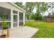 A well-maintained backyard featuring a screened-in porch, shed and lush green grass at 1989 Nitsa St, Johns Island, SC 29455