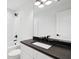 Bathroom with dark vanity top, tub/shower combo, and brushed bronze finishes at 1989 Nitsa St, Johns Island, SC 29455