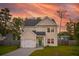 Inviting two-story home features a well-maintained lawn and an attached garage at 1989 Nitsa St, Johns Island, SC 29455