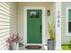 Close-up of the home's entry, showing the vibrant green front door and house number at 1989 Nitsa St, Johns Island, SC 29455