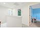 Upstairs hallway leads to bedrooms, featuring light gray carpet and access to a sky blue room at 1989 Nitsa St, Johns Island, SC 29455