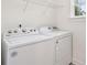 White laundry machines with shelf and window in laundry room at 1989 Nitsa St, Johns Island, SC 29455