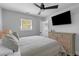 Bright bedroom with ceiling fan, natural light, and a mounted TV at 1990 Butternut St, Charleston, SC 29414