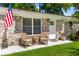 Inviting front porch with comfortable rocking chairs offering a cozy outdoor seating area at 1990 Butternut St, Charleston, SC 29414