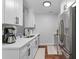 Modern kitchen with stainless steel appliances, white cabinets, and stylish countertops at 1990 Butternut St, Charleston, SC 29414