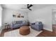 Modern living room showcasing stylish seating, a geometric rug, and a sleek ceiling fan at 1990 Butternut St, Charleston, SC 29414
