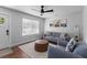Modern living room showcasing stylish seating, a geometric rug, and a sleek ceiling fan at 1990 Butternut St, Charleston, SC 29414