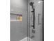 Modern shower with gray subway tile, a niche, and glass door at 1990 Butternut St, Charleston, SC 29414