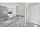 Bathroom with a large mirror reflecting double sinks, countertops, and a tiled shower at 206 Palfrey Dr, Ridgeville, SC 29472