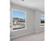 Well-lit bedroom featuring neutral walls and carpet, with exterior view at 206 Palfrey Dr, Ridgeville, SC 29472