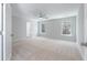Spacious bedroom featuring plush carpeting, a ceiling fan, and abundant natural light from dual windows at 206 Palfrey Dr, Ridgeville, SC 29472