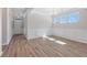 Elegant dining room featuring wood floors, wainscoting, and a stylish chandelier at 206 Palfrey Dr, Ridgeville, SC 29472