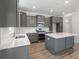 Stylish kitchen features gray cabinets, white backsplash and stainless appliances at 206 Palfrey Dr, Ridgeville, SC 29472