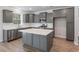 Well-lit kitchen with gray cabinets, white countertops and modern stainless steel appliances at 206 Palfrey Dr, Ridgeville, SC 29472