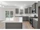 Modern kitchen with white countertops, gray cabinets, and stainless steel appliances at 206 Palfrey Dr, Ridgeville, SC 29472