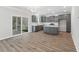 Modern kitchen with stainless steel appliances, gray cabinets and hardwood floors at 206 Palfrey Dr, Ridgeville, SC 29472