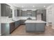 Well-lit kitchen with gray cabinets, white countertops and modern stainless steel appliances at 206 Palfrey Dr, Ridgeville, SC 29472