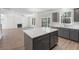 Modern kitchen with white countertops, gray cabinets and stainless steel appliances at 206 Palfrey Dr, Ridgeville, SC 29472