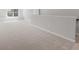 Bright loft area featuring neutral carpeting, and a staircase at 206 Palfrey Dr, Ridgeville, SC 29472
