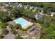 Aerial view of community pool, playground, and surrounding homes and mature trees at 207 Breckingridge Dr, Ladson, SC 29456