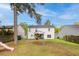 Exterior view of home's spacious backyard with playset, lush grass, and privacy fence at 207 Breckingridge Dr, Ladson, SC 29456