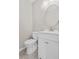Clean bathroom with a white vanity, a round mirror, and a toilet at 207 Breckingridge Dr, Ladson, SC 29456