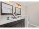 Double sink bathroom with dark wood cabinets, white countertops, and decorative lighting at 207 Breckingridge Dr, Ladson, SC 29456