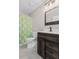 Bathroom showcasing a single sink vanity, wooden framed mirror, and a whimsical duck-themed shower curtain at 207 Breckingridge Dr, Ladson, SC 29456