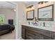 Double sink bathroom with dark wood cabinets, white countertops, and neutral walls at 207 Breckingridge Dr, Ladson, SC 29456