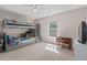 Bright bedroom with a bunk bed, plush carpeting, ceiling fan, and ample natural light from a window at 207 Breckingridge Dr, Ladson, SC 29456