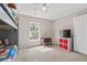 Inviting bedroom featuring plush carpeting, a window, and a TV with storage unit, providing a cozy retreat at 207 Breckingridge Dr, Ladson, SC 29456