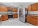 Well-lit kitchen features stainless steel appliances, granite countertops, and ample cabinet space at 207 Breckingridge Dr, Ladson, SC 29456