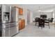 View of kitchen refrigerator, dining area, and the living room fireplace at 207 Breckingridge Dr, Ladson, SC 29456