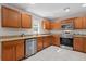 Kitchen displays updated stainless steel appliances and granite countertops at 207 Breckingridge Dr, Ladson, SC 29456