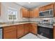 Updated kitchen featuring stainless steel appliances, granite countertops and natural light at 207 Breckingridge Dr, Ladson, SC 29456