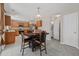 Bright kitchen boasts wood cabinets, granite counters, stainless appliances, and an adjacent breakfast area at 207 Breckingridge Dr, Ladson, SC 29456