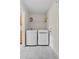 Convenient laundry room is equipped with a washer, dryer, and storage shelves at 207 Breckingridge Dr, Ladson, SC 29456