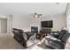 Inviting living room with a fireplace, plush seating, a ceiling fan, and a large TV at 207 Breckingridge Dr, Ladson, SC 29456