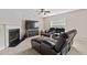 Comfortable living room featuring a fireplace, a ceiling fan, and a large TV perfect for relaxation at 207 Breckingridge Dr, Ladson, SC 29456