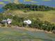 Beautiful aerial view of waterfront homes surrounded by lush greenery and serene marshlands at 226 Old House Ln, Dewees Island, SC 29451