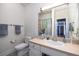 This bathroom features a decorative mirror, plush towels, and a toilet at 226 Old House Ln, Dewees Island, SC 29451