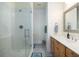 This sleek bathroom features a glass shower, storage, and single sink at 226 Old House Ln, Dewees Island, SC 29451