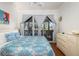 This lovely bedroom features unique decor, a ceiling fan, and a view of the outdoors at 226 Old House Ln, Dewees Island, SC 29451