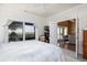 This lovely bedroom features a view of the ocean, ceiling fan, and opens to another living space at 226 Old House Ln, Dewees Island, SC 29451