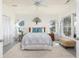 Cozy bedroom with soft rug, neutral tones, two windows and a comfortable bed at 226 Old House Ln, Dewees Island, SC 29451