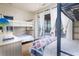 This unique bedroom features bunk beds, hardwood floors, and access to the balcony at 226 Old House Ln, Dewees Island, SC 29451