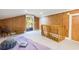 This carpeted bedroom features access to the balcony and unique decor at 226 Old House Ln, Dewees Island, SC 29451