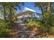 Charming two-story coastal home featuring a spacious covered porch and views of the marsh at 226 Old House Ln, Dewees Island, SC 29451